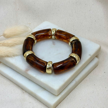 Bracelet élastique doré en acier inoxydable pour femme et perles tubes motifs écailles de tortue et perle dorées prise face - Zoela